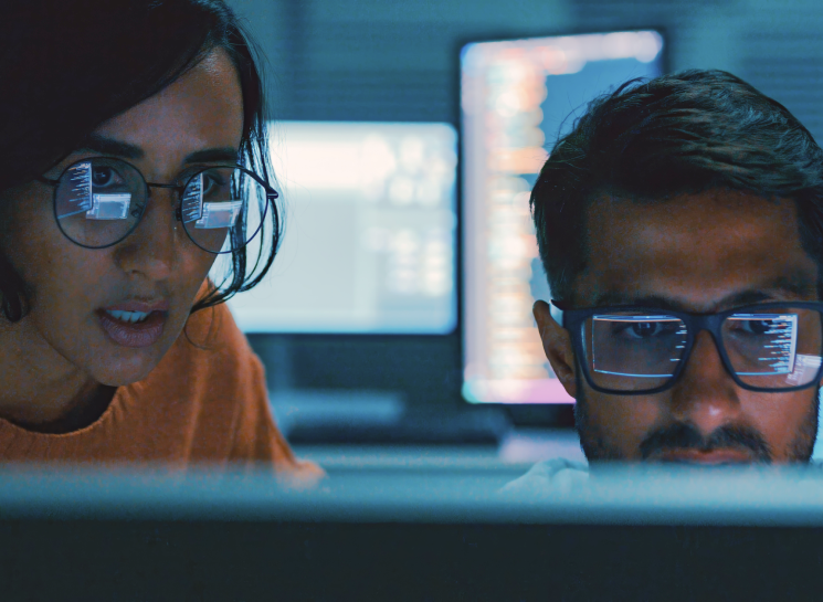 CERT overview image of two people looking at a computer